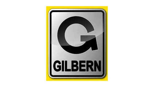 Логотип Gilbern 1973 года: серебристая буква G со стрелкой, значок на капоте T11